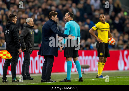 London, UK. 13th Feb, 2019. Mauricio Pochettino manager of Tottenham Hotspur talks to match referee during the UEFA Champions League round of 16 match between Tottenham Hotspur and Borussia Dortmund at Wembley Stadium, London, England on 13 February 2019. Photo by Salvio Calabrese. Editorial use only, license required for commercial use. No use in betting, games or a single club/league/player publications. Credit: UK Sports Pics Ltd/Alamy Live News Stock Photo