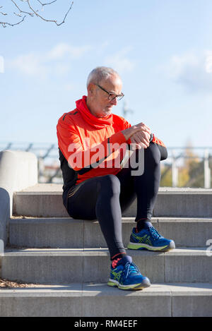 Portrait of a senior man using a smart watch. Stock Photo