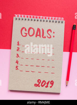 Top view of notepad with Goals List, plan concept Stock Photo