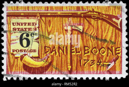 USA - CIRCA 1968: A Stamp printed in USA shows the Rifle, Powder Horn, Tomahawk Pipe & Knife, devoted to Daniel Boone (1734-1820), frontiersman and tr Stock Photo