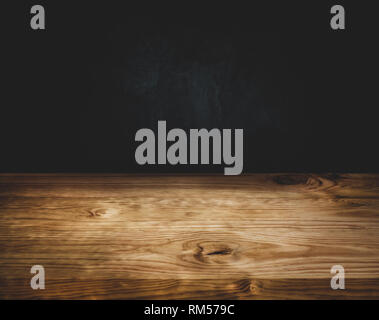 Empty wood table top counter on dark wall background.For create product display or design key visual layout Stock Photo