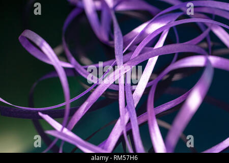 washi tape for handicraft. many abstract purple lines at dark glass background. selective focus. creativity texture pattern for design or decor. Stock Photo
