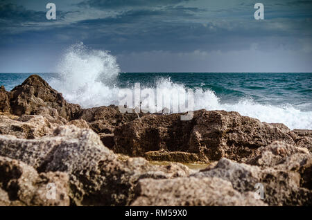 waves crashing on rocks Stock Photo