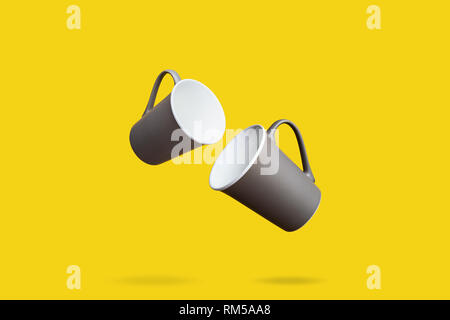Flying Concept Group of Dark Brown Gray Porcelain Coffee Tea Cups on Yellow Background Stock Photo