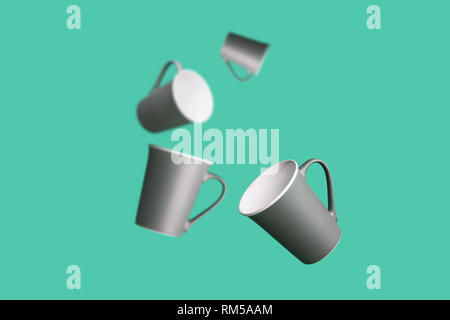 Flying Concept Group of Dark Brown Gray Porcelain Coffee Tea Cups on Green Background Minimal Style Stock Photo