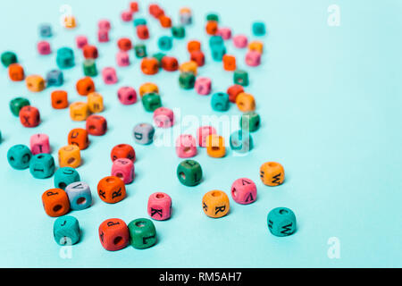 Colored cubes with letters on a blue background. Concept of creativity, ideas, education, school Stock Photo