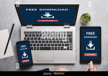 Subscribe newsletter concept on laptop, tablet and smartphone screen over gray table. All screen content is designed by me. Flat lay Stock Photo