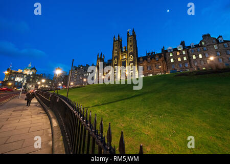 Night view of Edinburgh University New College building on The Mound in Edinburgh Old Town, Scotland, UK Stock Photo