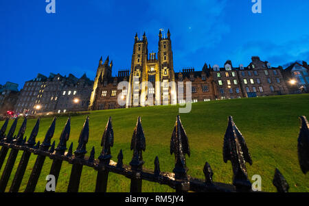 Night view of Edinburgh University New College building on The Mound in Edinburgh Old Town, Scotland, UK Stock Photo