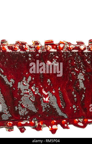 detail of bloody chainsaw isolated on white background Stock Photo
