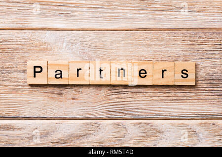 Partners word written on wood block. Partners text on wooden table for your desing, concept. Stock Photo