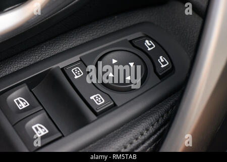 Side mirror control button for adjusting the side mirrors in the proper direction Stock Photo