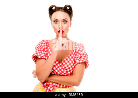Pin up girl in retro clothes showing silence sign isolated on white Stock Photo