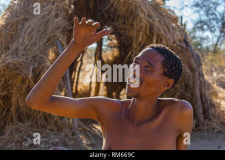 Bushman, Kalahari Desert, Namibia. The Bushmen are indigenous people of southern Africa that span areas of South Africa, Zimbabwe, Lesotho, Mozambique Stock Photo