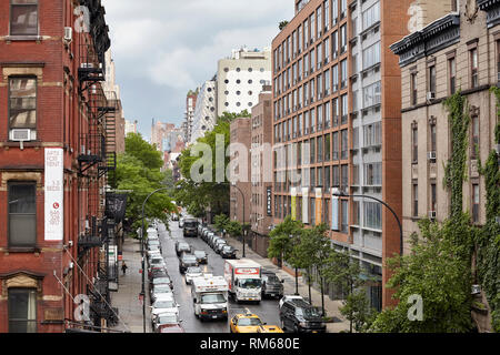 New York, USA - June 28, 2018: Traffic on West 17th Street seen from the High Line on a rainy day. Stock Photo