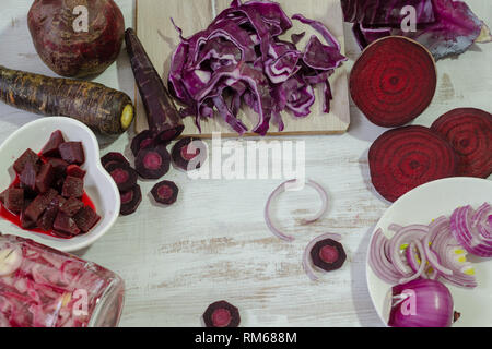Fresh raw vegetables (onion,cabbage,carrots,beet,) on white wooden background. Bio Healthy food concept.Top view Stock Photo