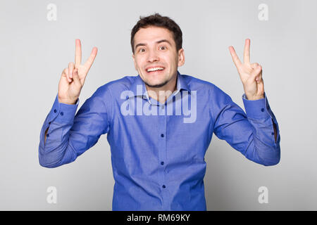 Funny guy showing peace Stock Photo