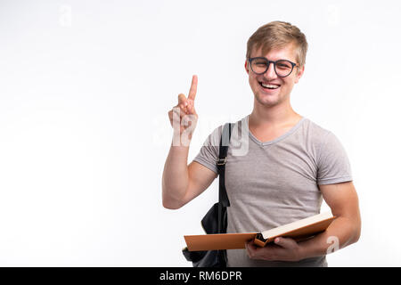 Education, university, idea and people concept - student with book showing finger up on white background with copy space Stock Photo