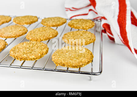 Freshly baked homemade digestive biscuits on cooling rack Stock Photo