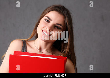woman holding folder in hand Stock Photo