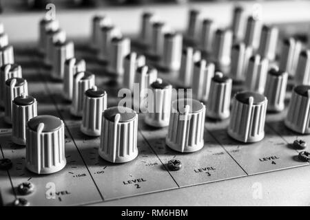 Close up of recording mixing desk for music in black and white Stock Photo