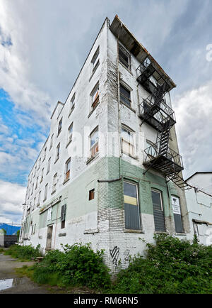 Vancouver, B.C., Canada - June 19, 2012: Rundown empty residential building along Powell Street, Downtown East Side photographed from a low angle Stock Photo
