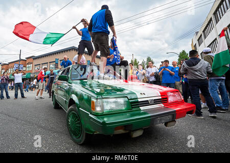 Vancouver, B.C., Canada - June 28, 2012: Italian football fans clebrating the victory at the semi finals at the 2012 UEFA European Championship Stock Photo