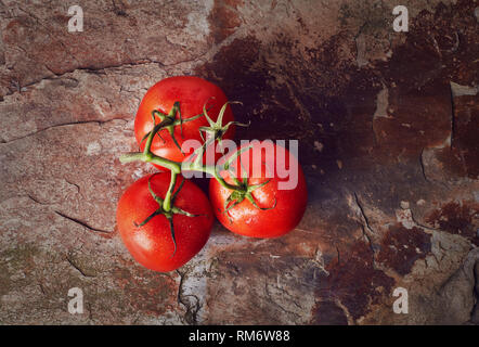 Cherry tomatoes on stone background Stock Photo