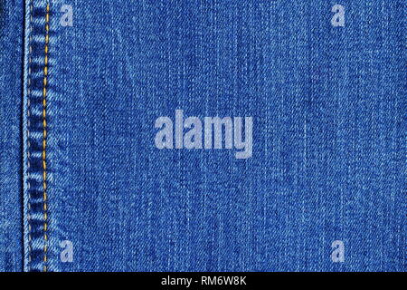 Blue denim jeans background. Fabric, texture backdrop for design purposes. Stock Photo