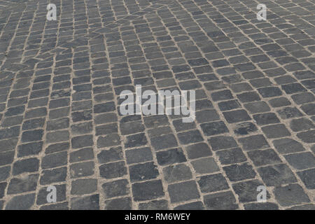 Street with cobblestone, here in the old town of Rome, Italy Stock Photo