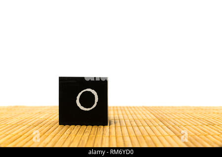 black number 1 block on bamboo underground and with isolated white background Stock Photo
