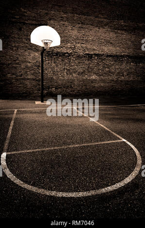 Urban basketball outdoors street ball in the hood park asphalt Stock Photo