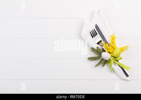 Spring table setting with mimosa easter holidays dinner Stock Photo