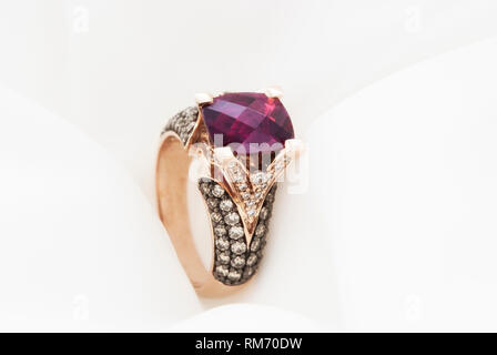 Rose Gold Ring With Rhodolite Garnet And Diamonds Stock Photo