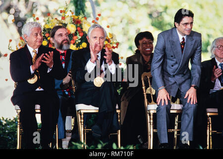 Artistic Director of the Miami City Ballet Edward Villella, right, stands as he is called to receive his National Medal of Arts award during a ceremony on the South Lawn of the White House September 29, 1997 in Washington, DC. Sitting left to right are: Percussionist Tito Puente, Jean Louis Bourgeois, Actor Jason Robards, Singer Betty Carter and Villella.