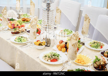 table set service with silverware and glass stemware at restaurant before party. Stock Photo