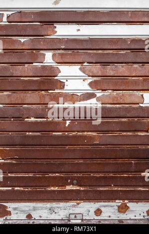 Old rusty garage shutter. Ideal for concepts and backgrounds. Stock Photo