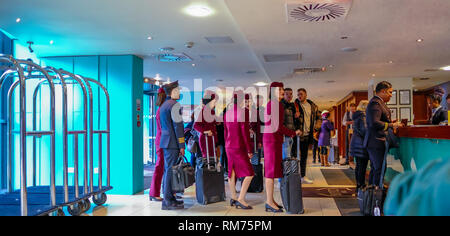 Manchester central, England, UK - January 20, 2019:  Cabin crew checking out in the receiption area of a hotel. Stock Photo