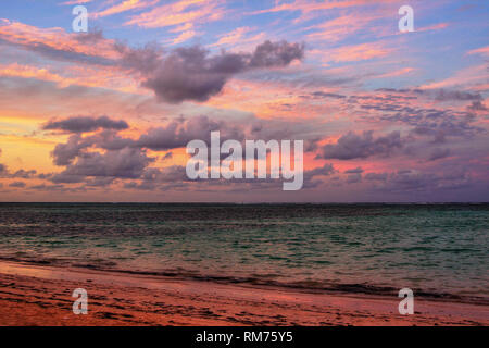 Stunning Caribbean tropical sunset on the beach, HDR Stock Photo
