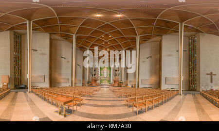 Nave with chairs at Coventry cathedral, England, looking to the north end with a tapestry of Jesus Christ in glory, by Graham Sutherland, above an alt Stock Photo