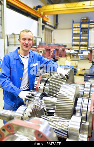 portrait of young cheerful workers in mechanical engineering Stock Photo