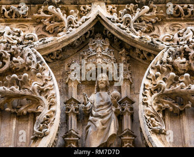 Detail of carved sandstone Jesus Christ figure, exterior of Cathedral Basilica, Malaga, Andalusia, Spain Stock Photo