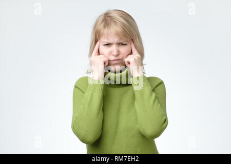 cute european girl seriously thinking about something. Stock Photo