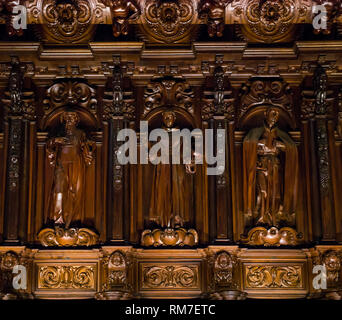 Carved religious wooden figures by Pedro de Mena, choir seats, Malaga Cathedral, Andalusia, Spain Stock Photo