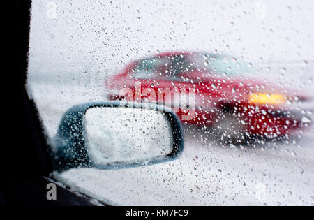 Detail of rear-view mirror in the rainy weather Stock Photo