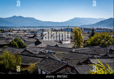 View of the cityscape and surrounding mountains, Lijiang old town, Yunnan province, China Stock Photo