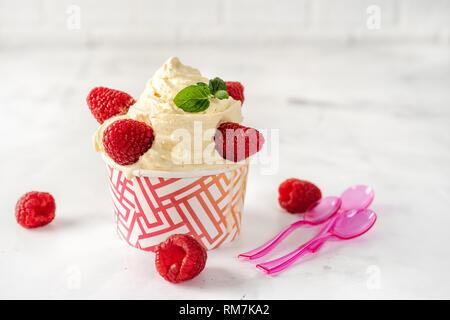 Soft ice cream in paper cup on white background Stock Photo