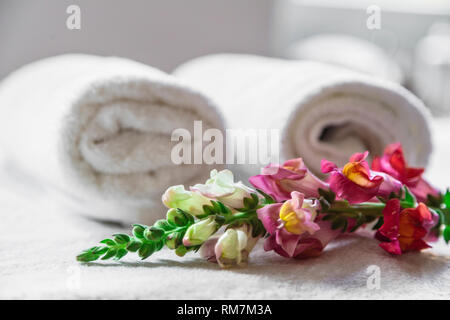 Textile towels with flower isolated on white Stock Photo