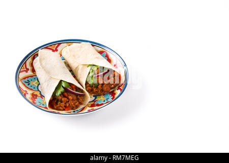 Typical Mexican burritos wraps with beef, frijoles and vegetables isolated on white background. Copyspace Stock Photo