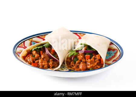 Typical Mexican burritos wraps with beef, frijoles and vegetables isolated on white background. Stock Photo